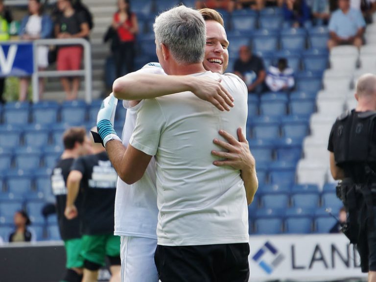 Game for Grenfell Olly Murrs hugging Jose Mourinho